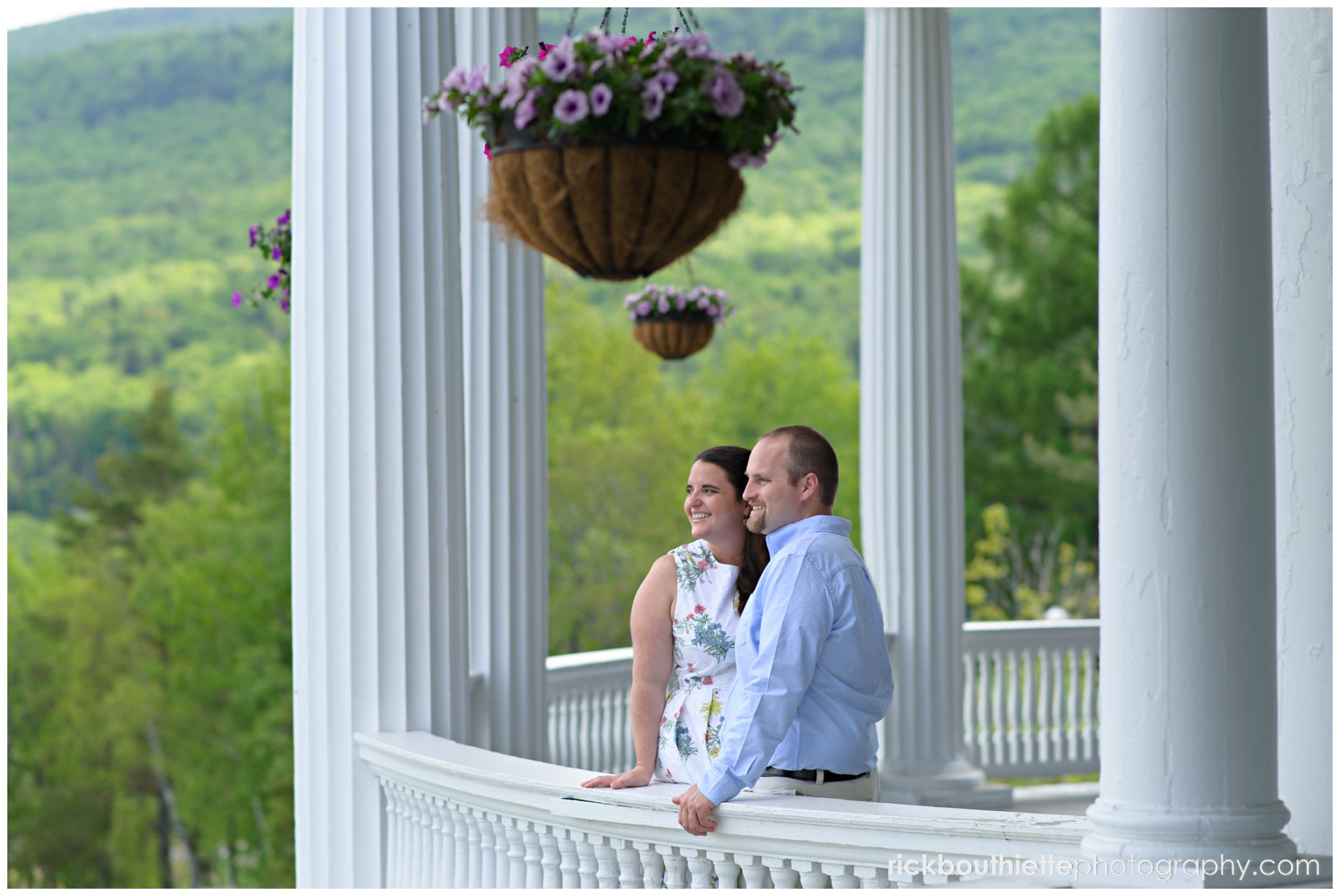 couple admiring the scenic vista at omni mount washington resort engagement session