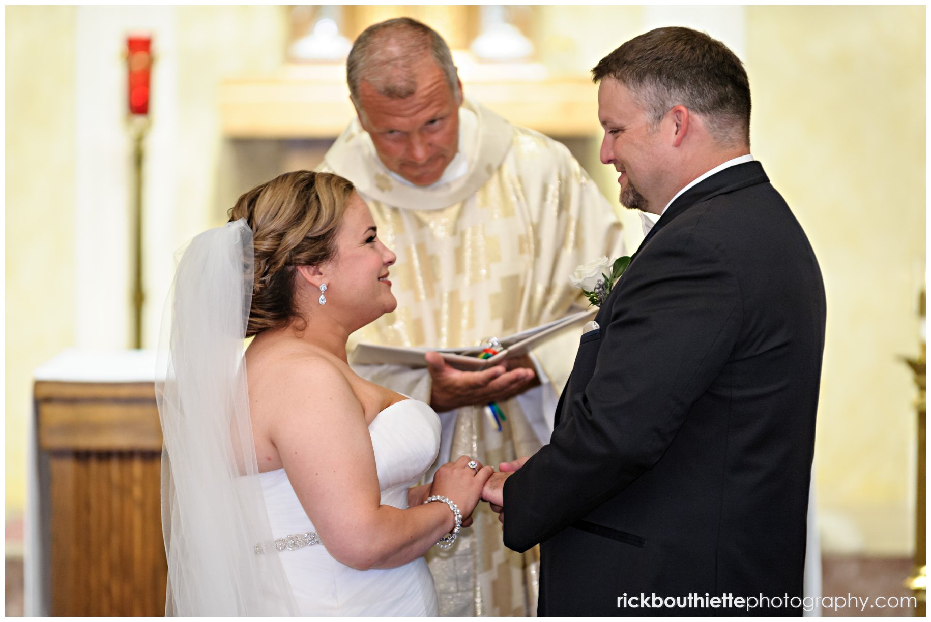 bride & groom exchange rings at seacoast NH wedding ceremony