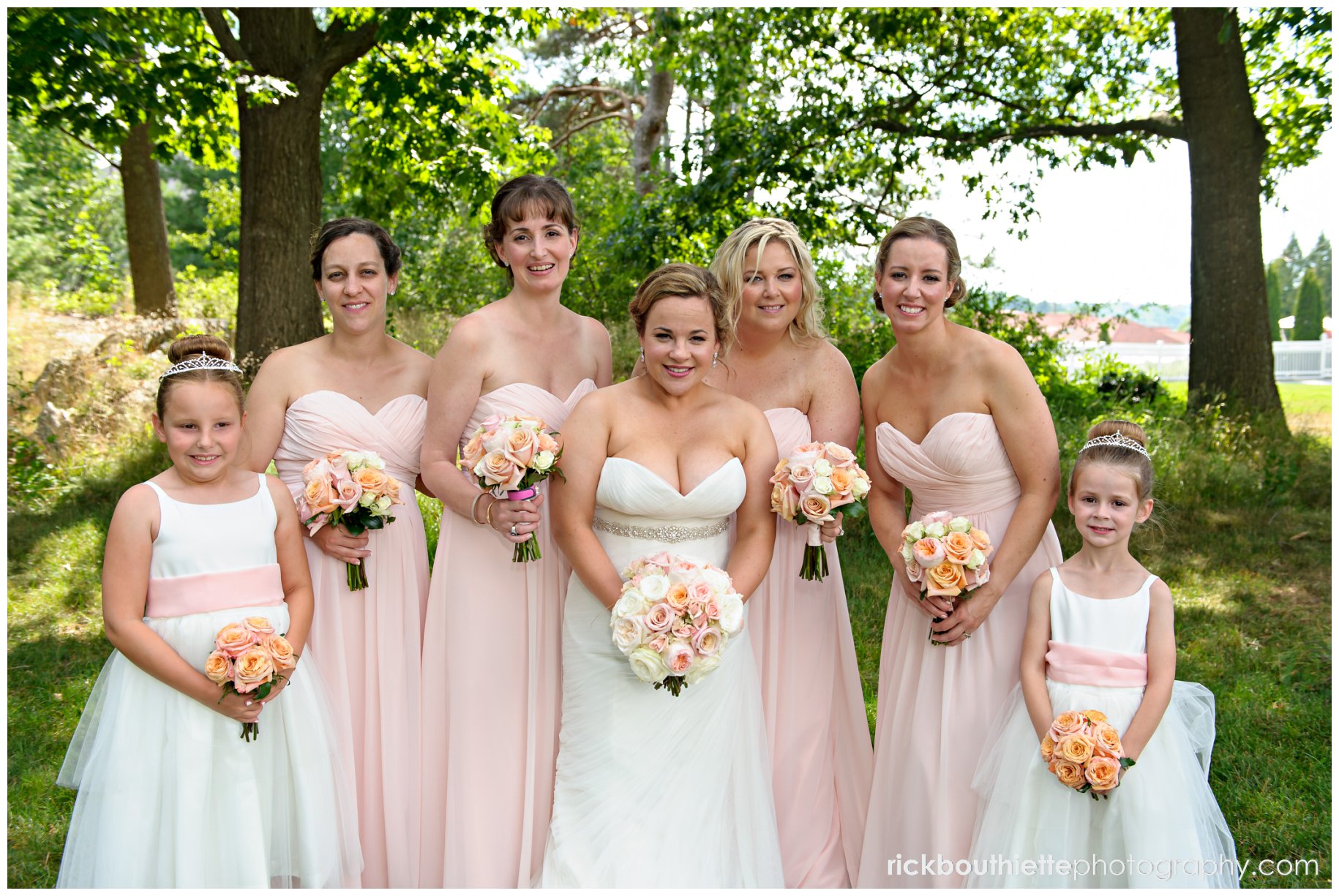 bride and her bridesmaids in the garden at Wentworth By The Sea wedding