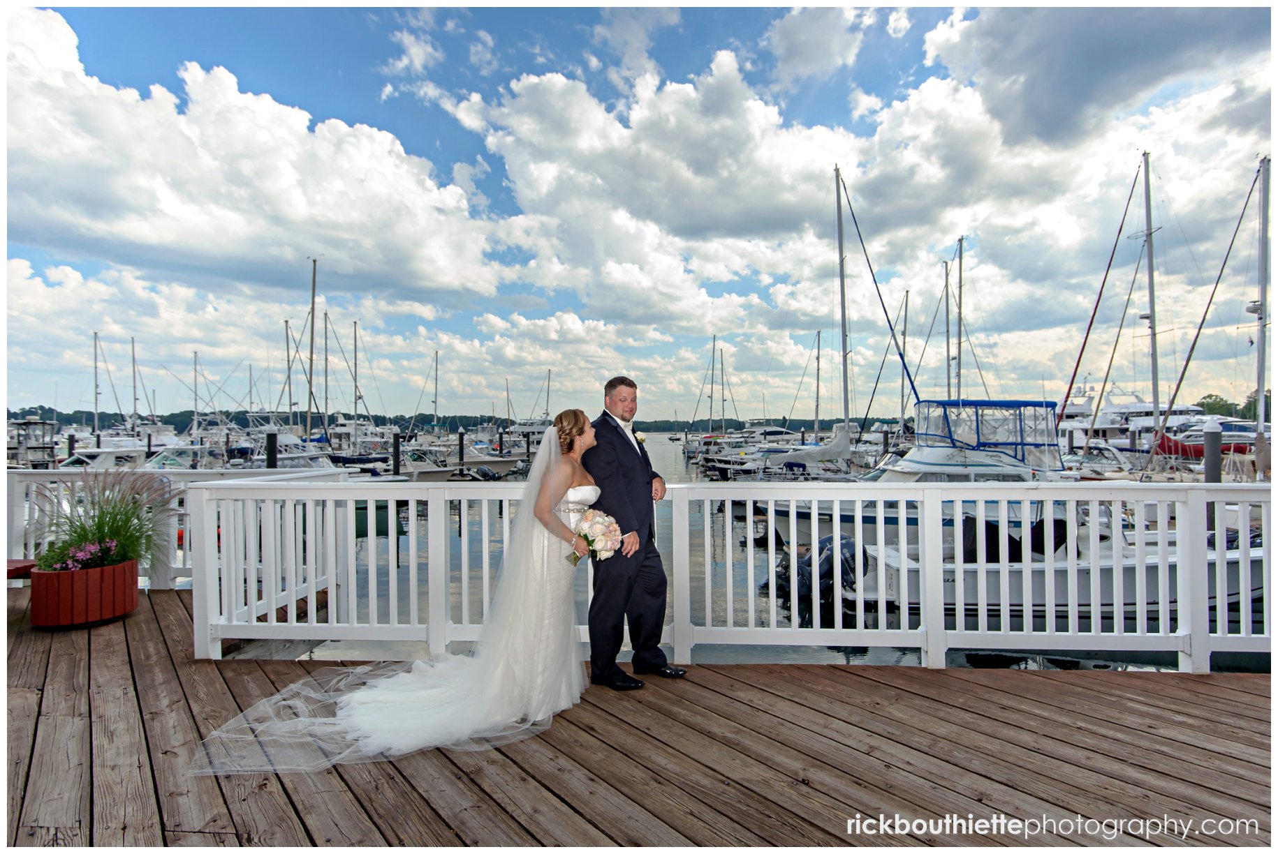 bride & groom overlooking the marina at their Wentworth By The Sea wedding
