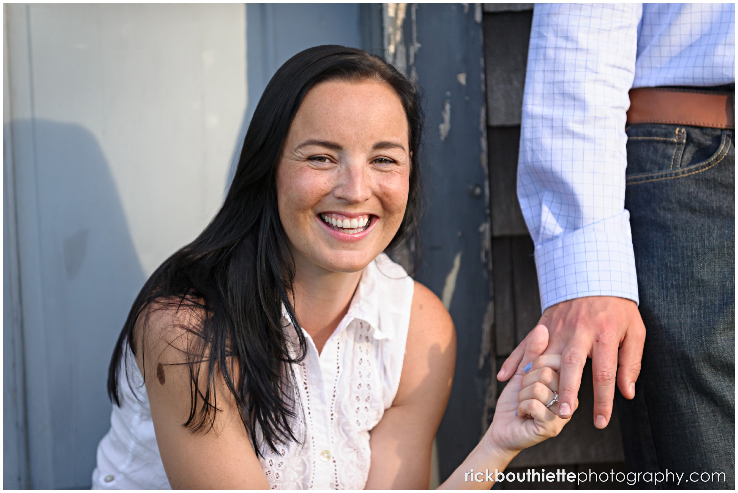 couple holding hands during seacoast engagement session