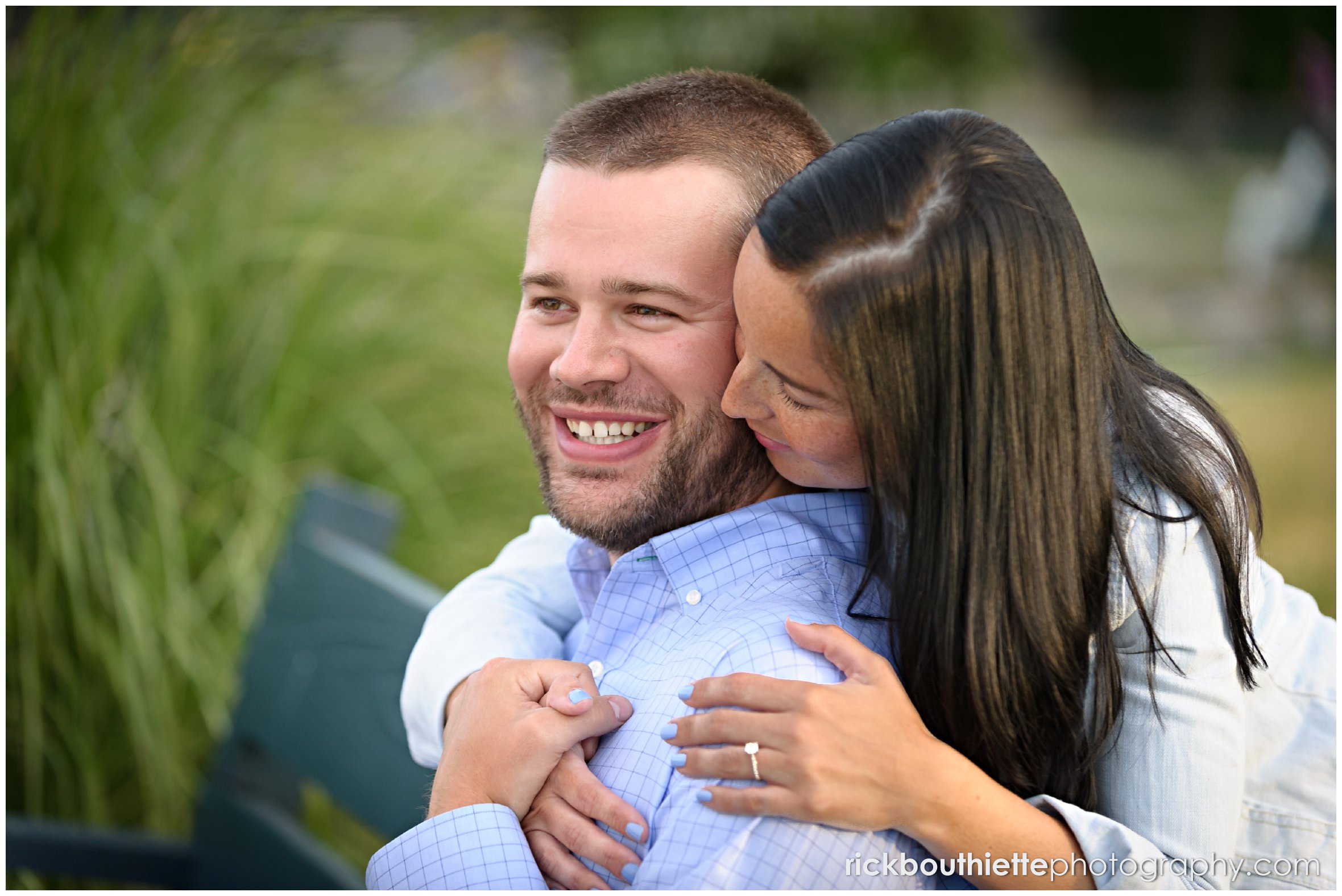 couple on bench in Prescott Park during seacoast engagement session