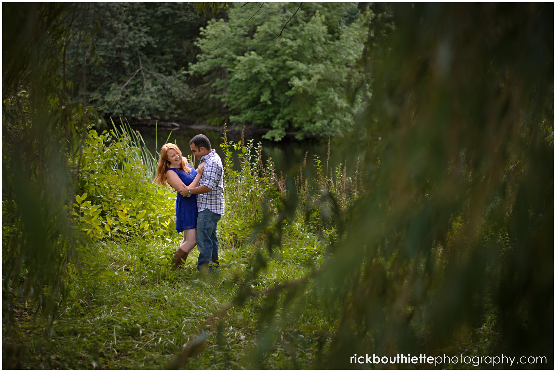 couple embracing and laughing during engagement session
