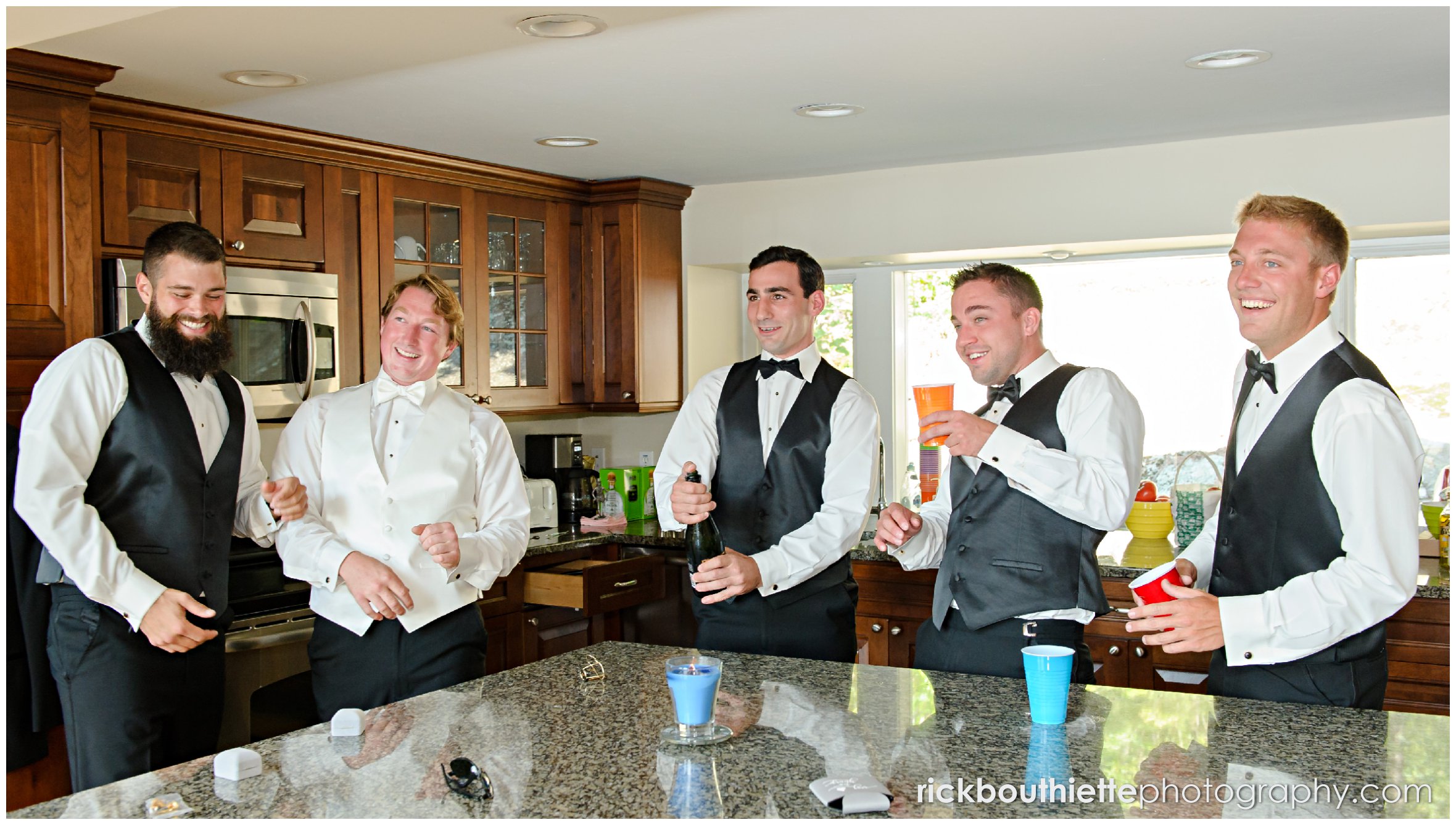 groomsmen laughing while getting ready for Castle In The Clouds wedding