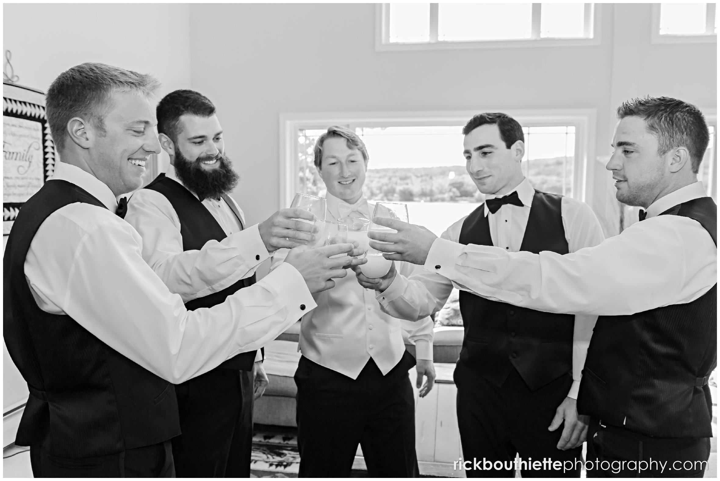 groom and groomsmen toast before Castle In The Clouds wedding