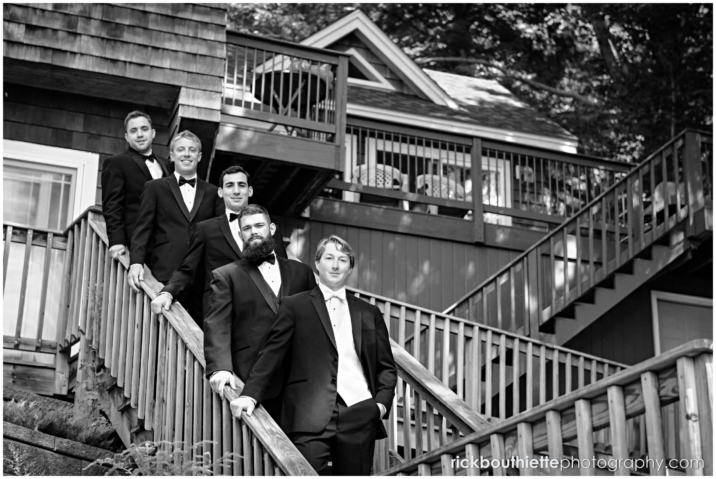 groom and groomsmen on stairs before Castle In The Clouds wedding