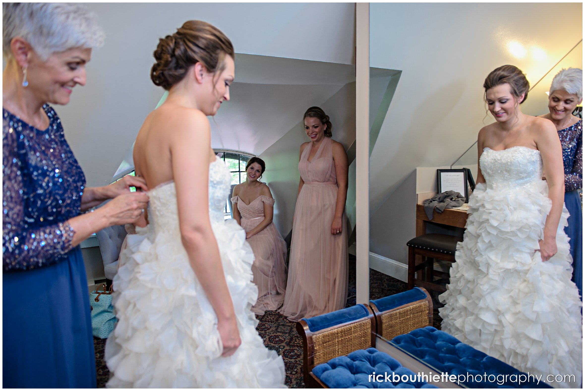 mother helping the bride get ready for her Castle In The Clouds wedding