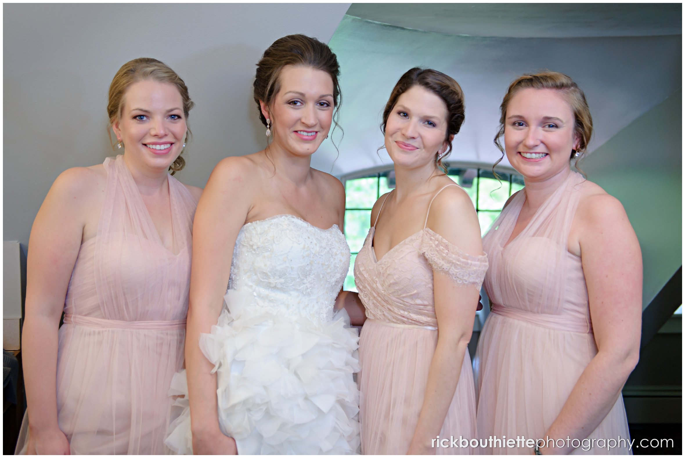 bride and her bridesmaids just before they walk down the aisle at Castle In The Clouds wedding