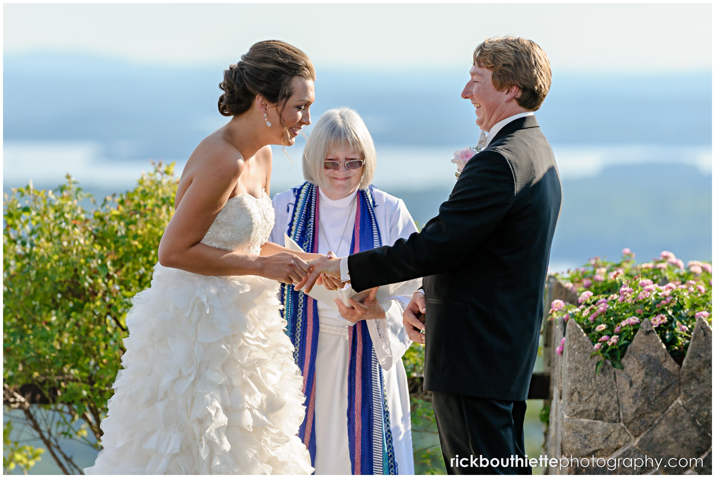 bride and groom laughing during wedding ceremony at their Castle In The Clouds wedding