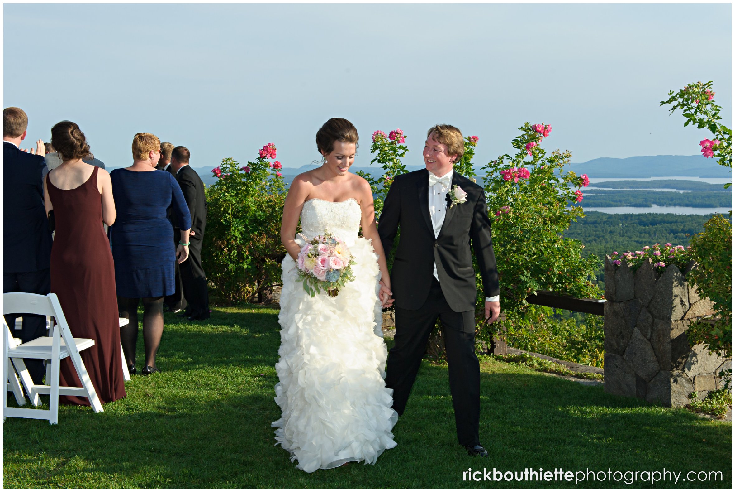 bride and groom walking away after their Castle In The Clouds wedding ceremony