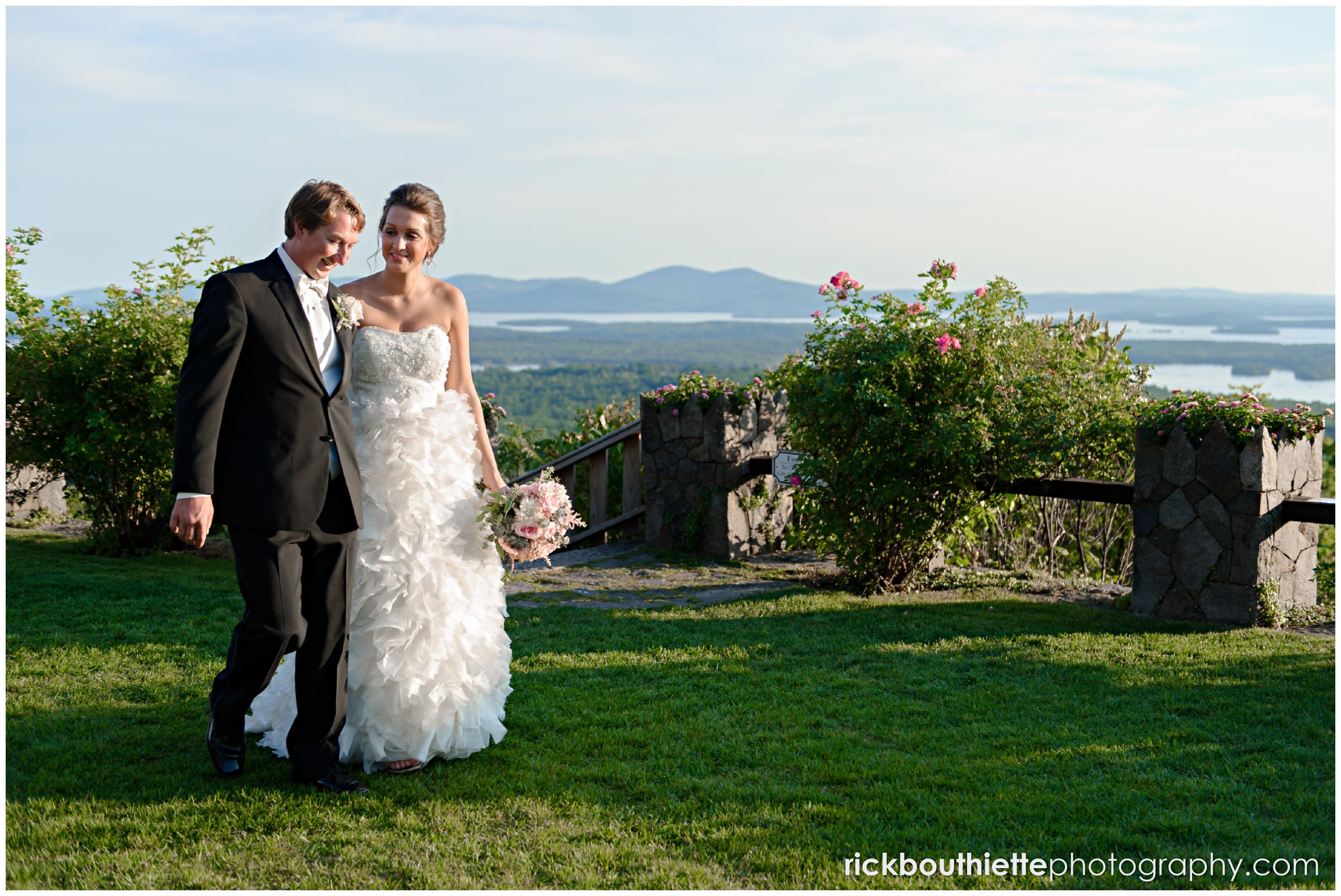 bride and groom walking across the castle lawn at Castle In The Clouds wedding