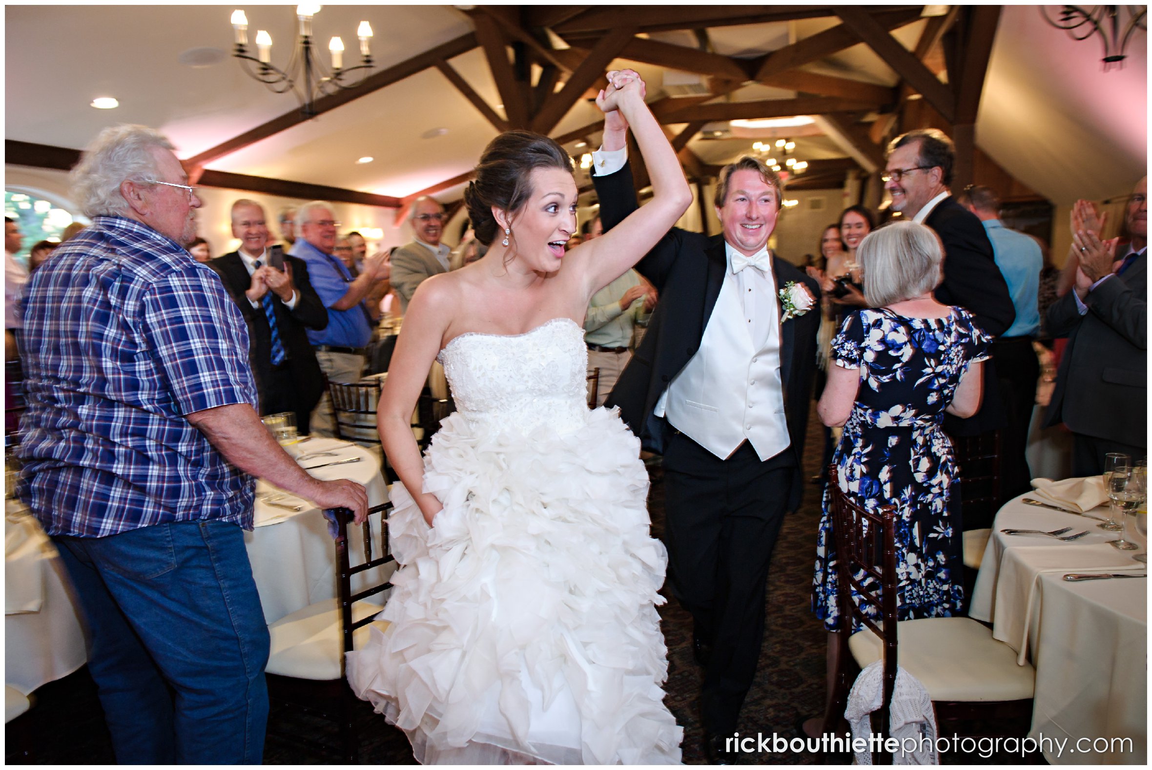 bride and groom entering their Castle In The Clouds wedding reception