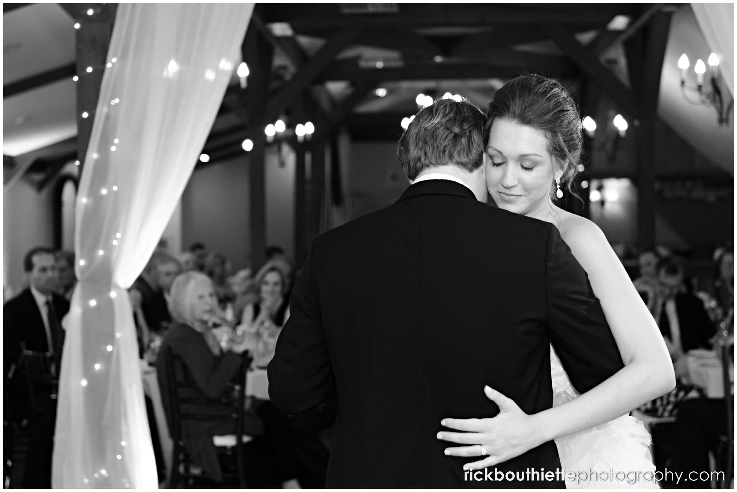black & white of bride and groom dancing at Castle In The Clouds wedding