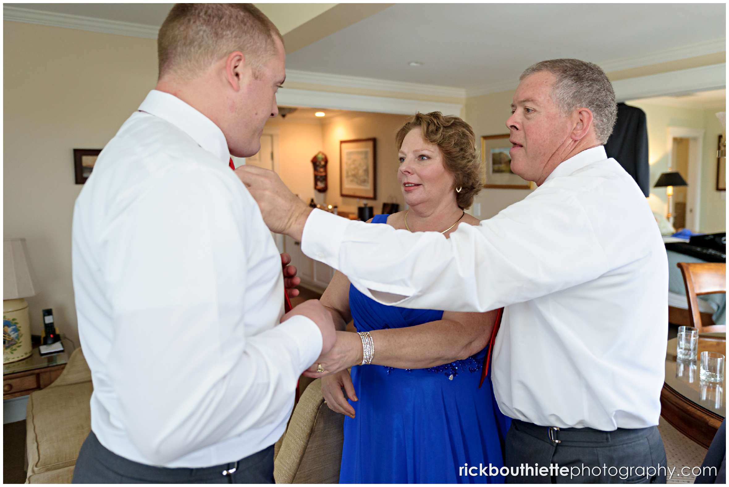 groom helped my parents as he gets ready for his wedding ceremony