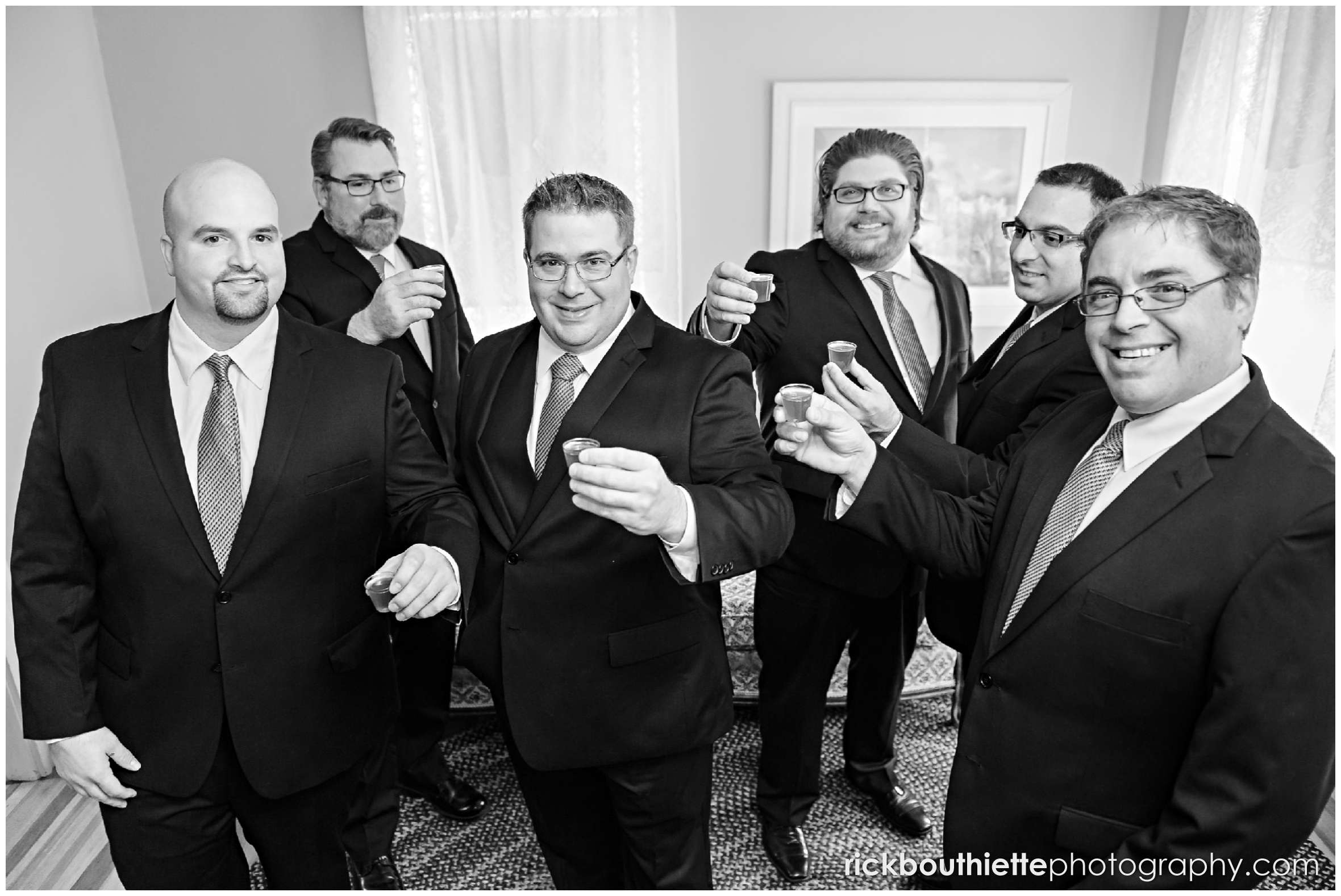 groom and groomsmen celebrate before seacoast wedding