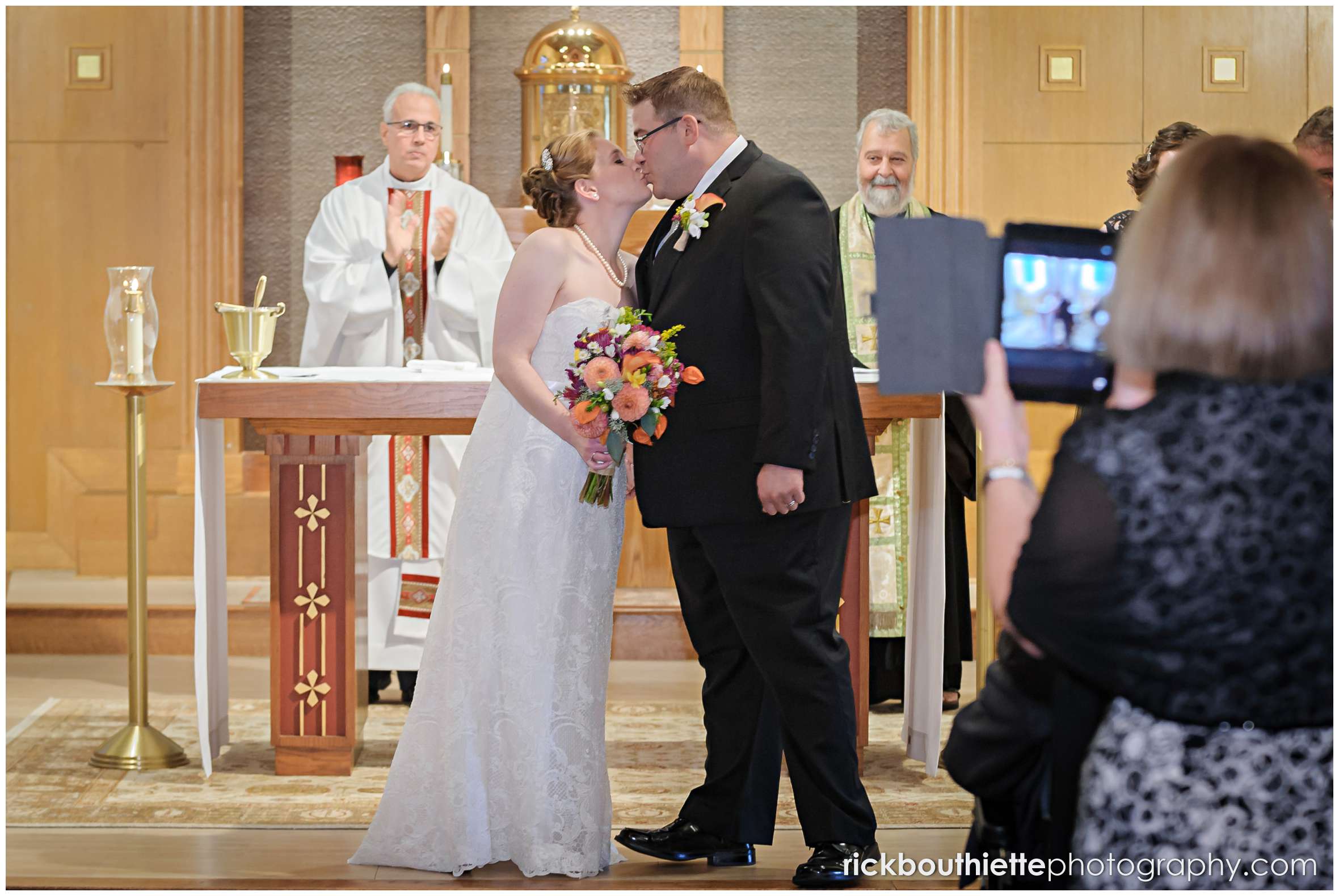 bride and groom kiss at seacoast wedding ceremony