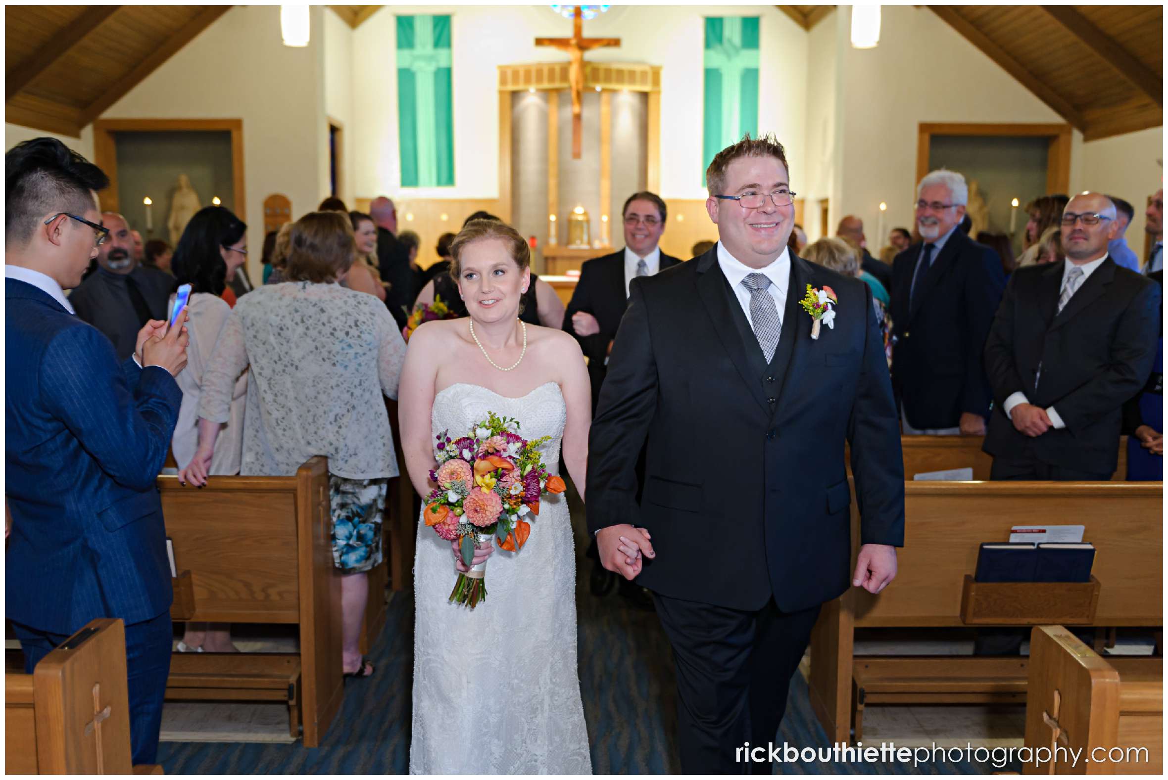 bride and groom walking down aisle after New Hampshire seacoast wedding ceremony