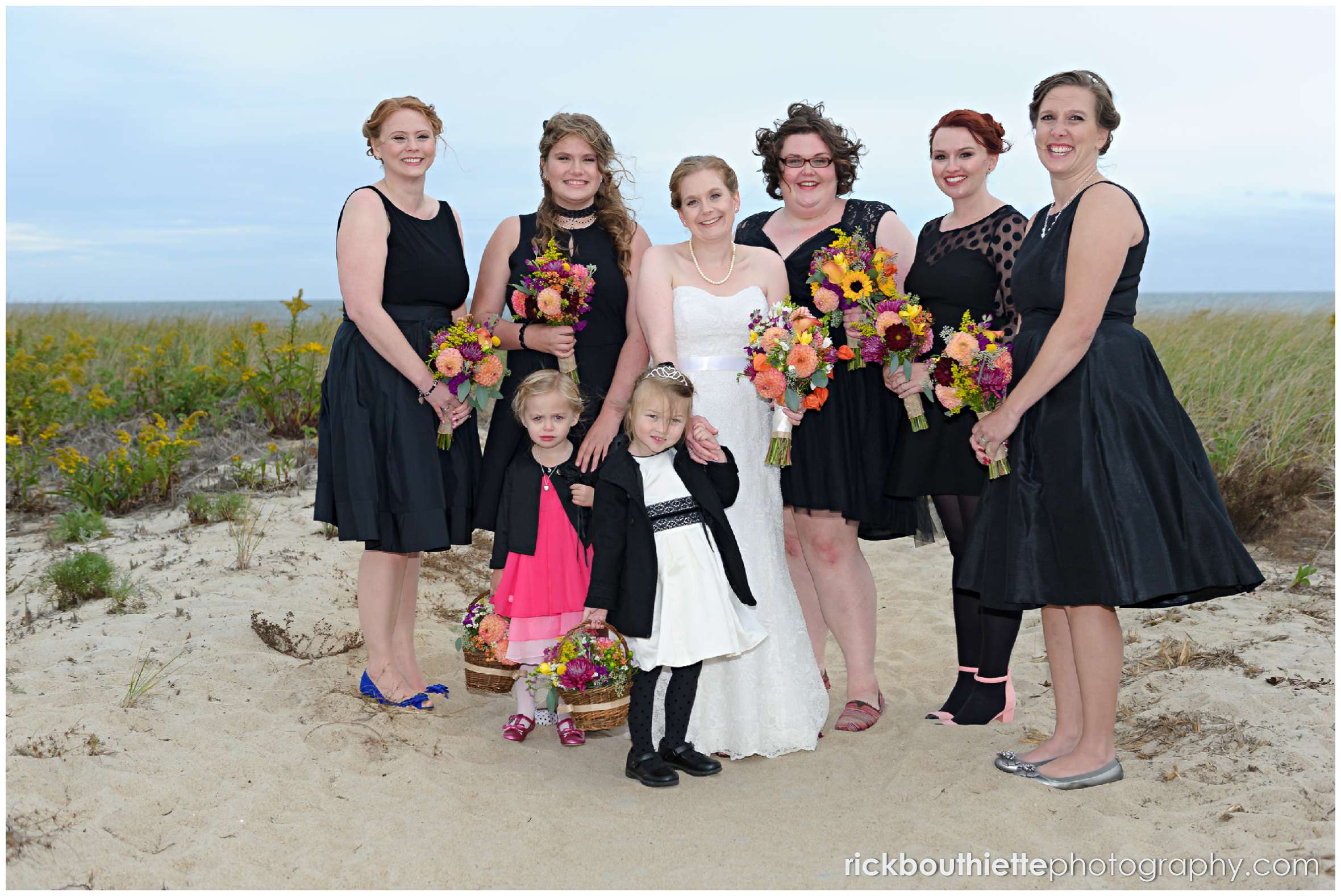 bride and bridesmaids on Seabrook beach after seacoast wedding ceremony