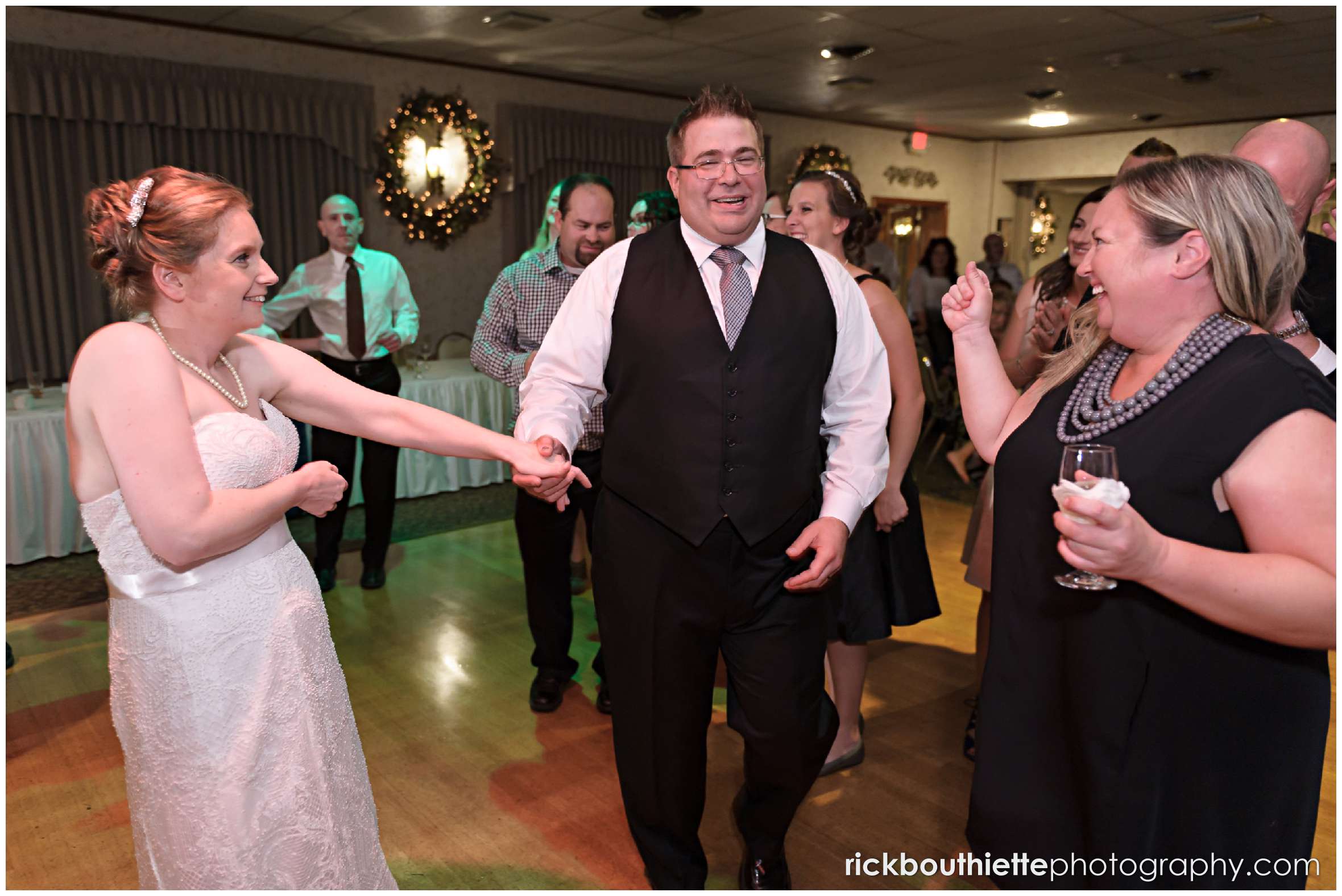 bride and groom dancing with guests at New Hampshire seacoast wedding