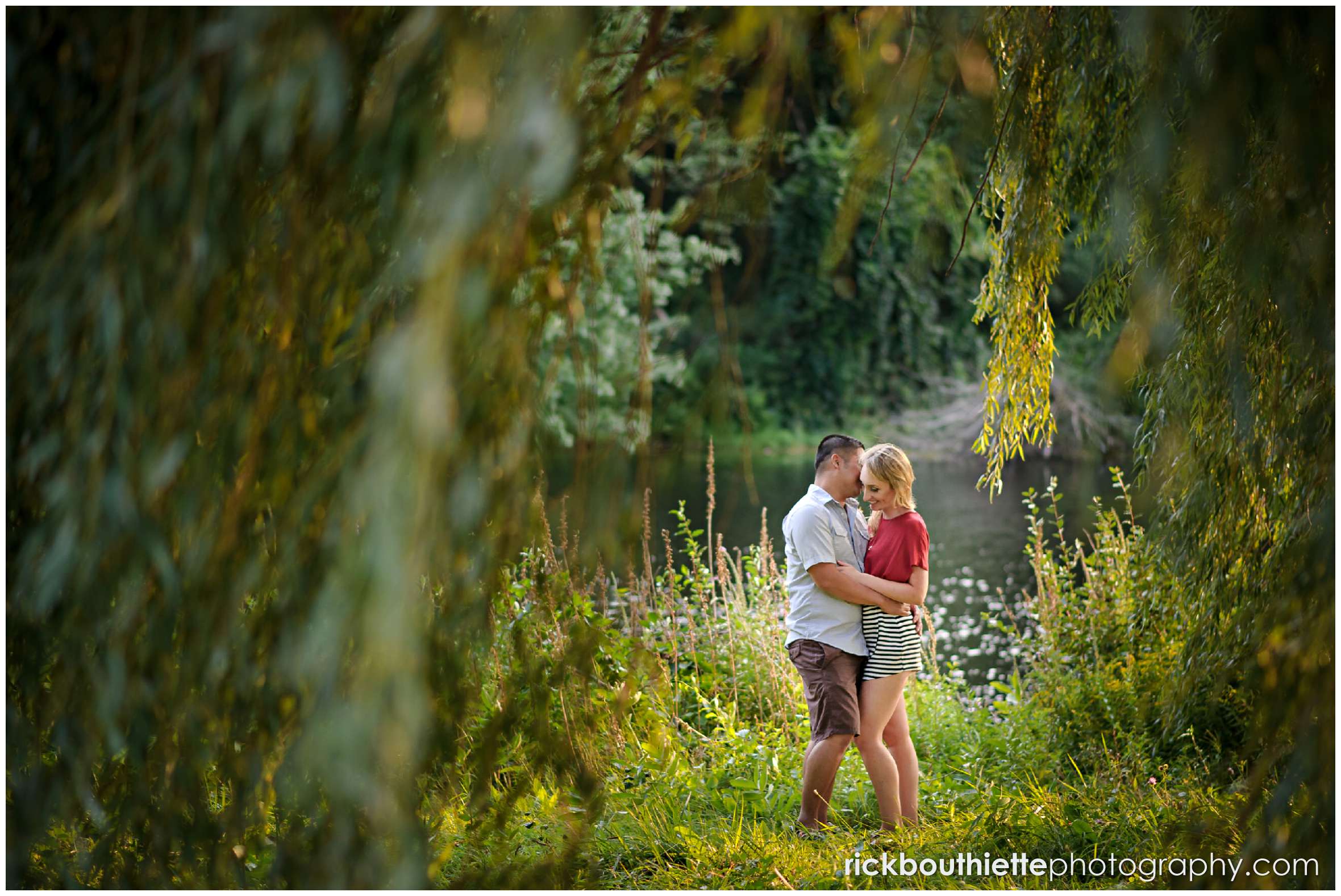 Couple sharing a romantic moment at apple orchard engagement session