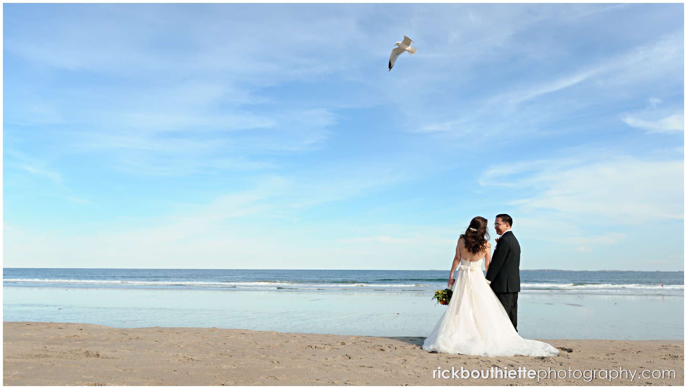bride and groom on the beach in Rye New Hampshire at Surf Club wedding