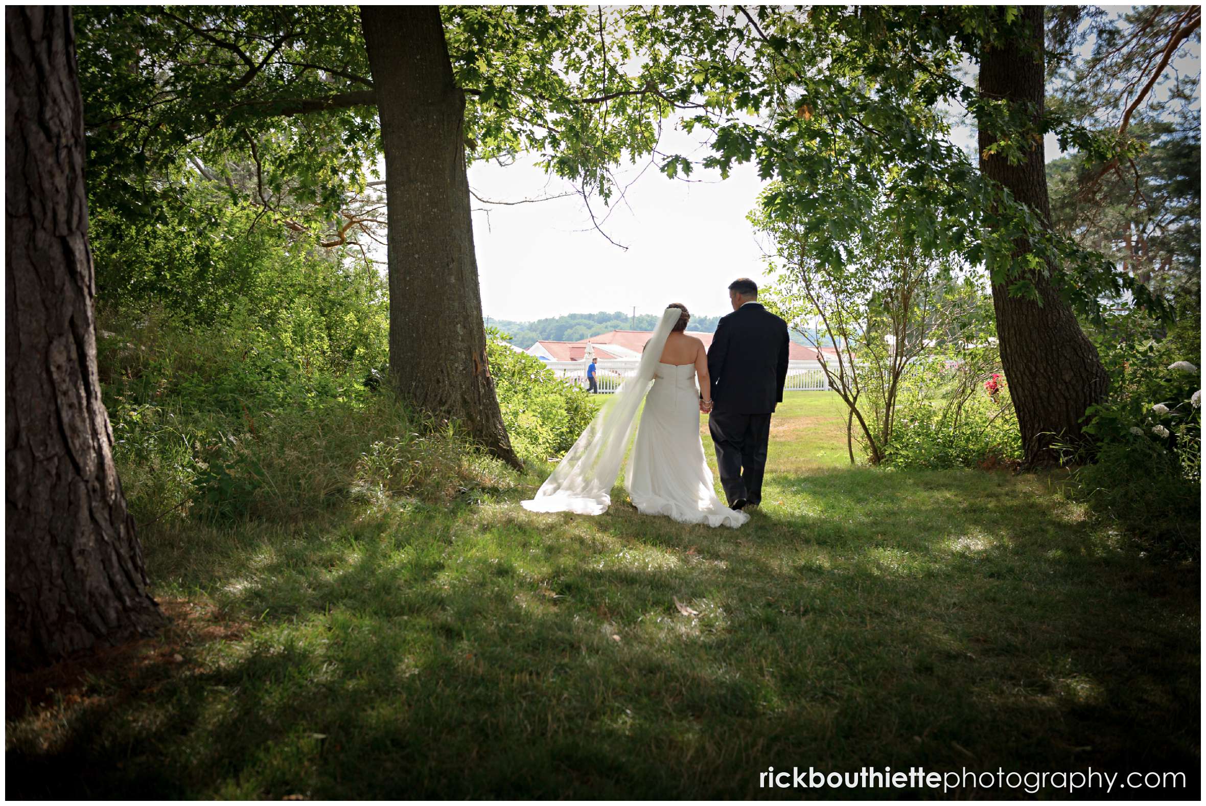 bride and groom walking in the gardens at Wentworth By The Sea wedding