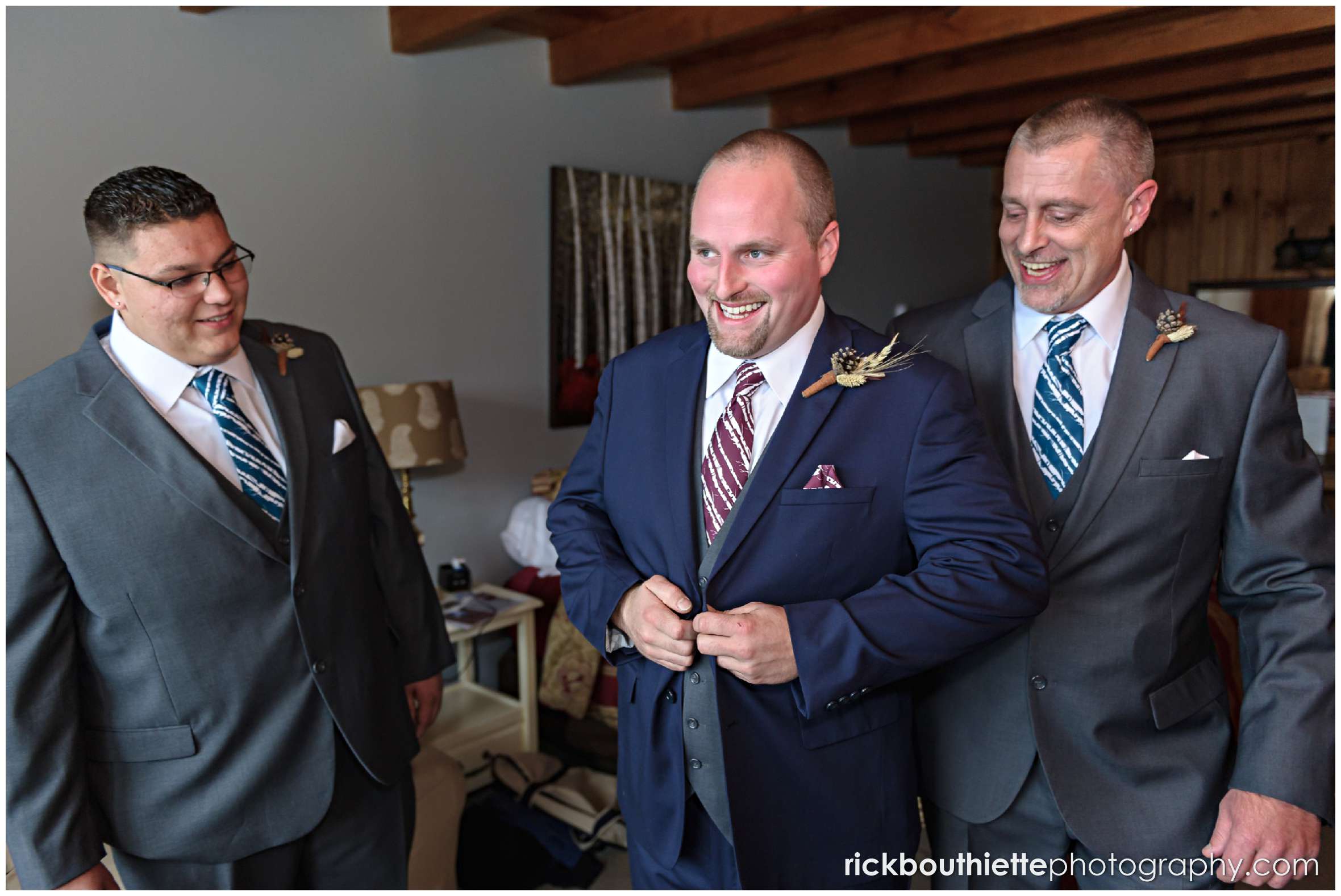 happy groom and his groomsmen getting ready for a Snowvillage Inn fall wedding