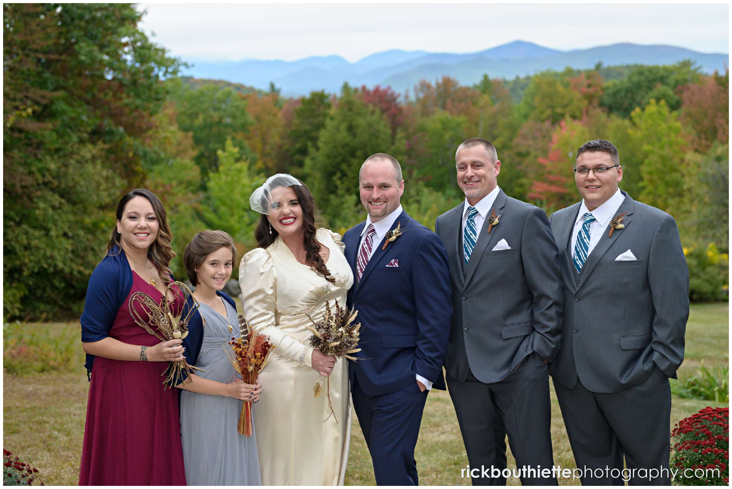 wedding party with fall foliage in background at Snowvillage Inn wedding