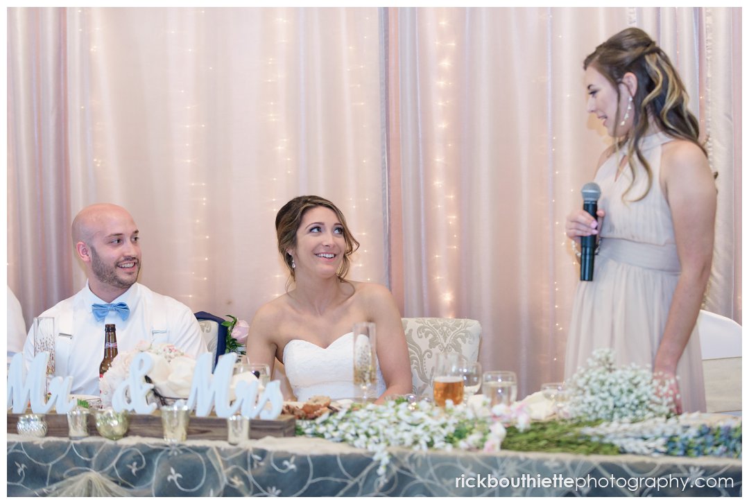 maid of honor toasts the bride and groom