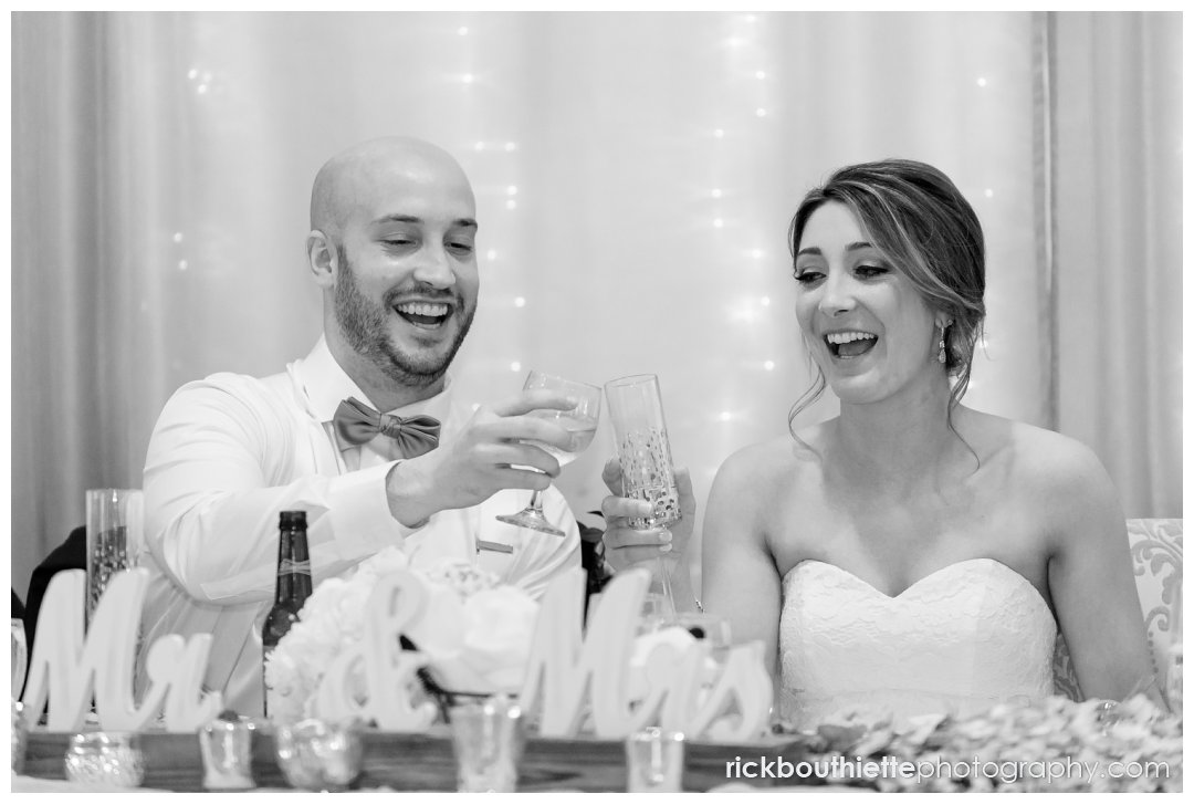 bride and groom toast at their Candia Woods wedding