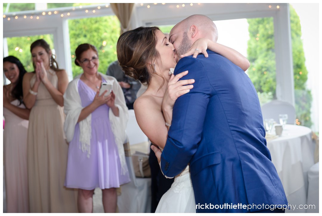 bride and groom kiss after their first dance at Candia Woods Evergreen Pavilion