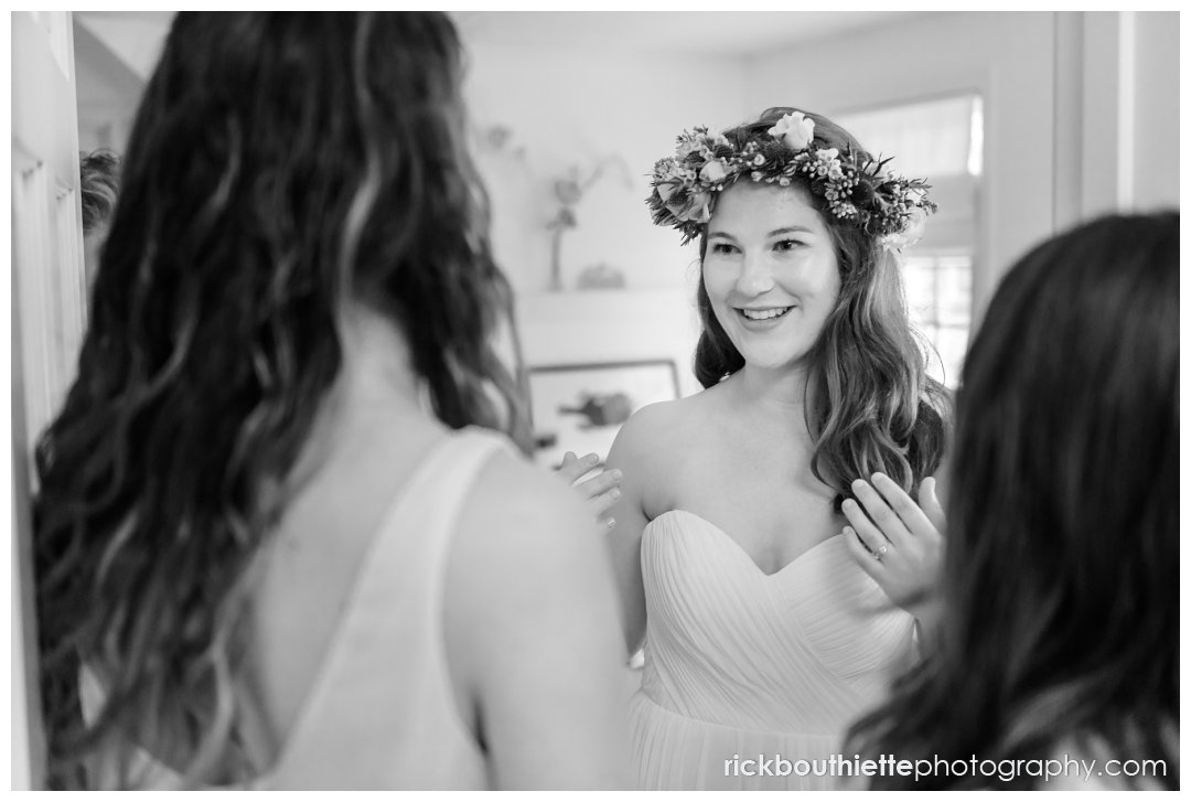bride reveals herself to her bridesmaids after she gets dressed for her New Hampshire Seacoast Science Center wedding