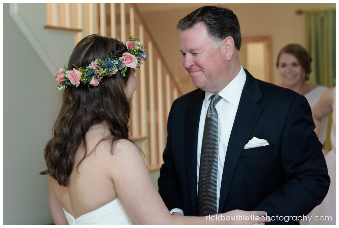 dad sees the bride in her dress for the first time as she prepares for her New Hampshire Seacoast Science Center wedding