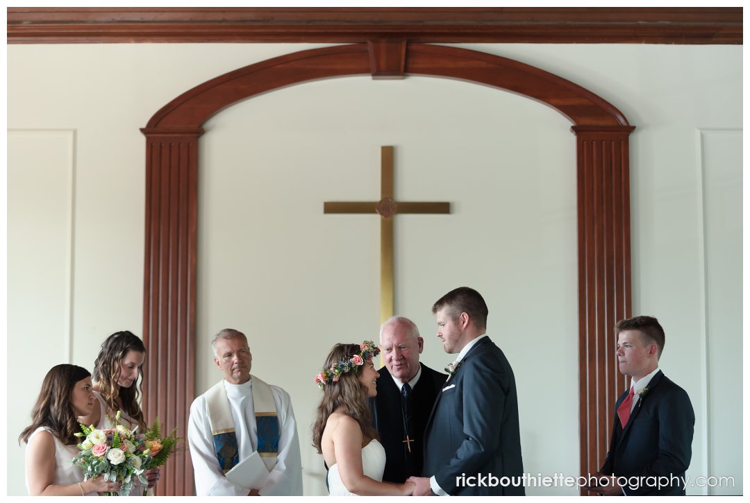 bride and groom exchange vows at New Hampshire seacoast wedding