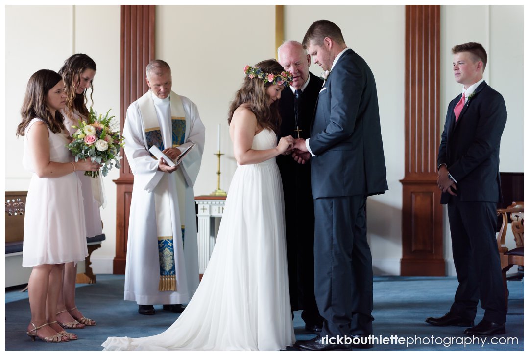 bride and groom exchange rings at New Hampshire seacoast wedding