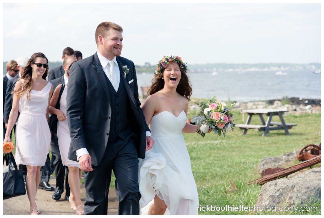 happy bride and groom walking at New Hampshire Seacoast Science Center wedding