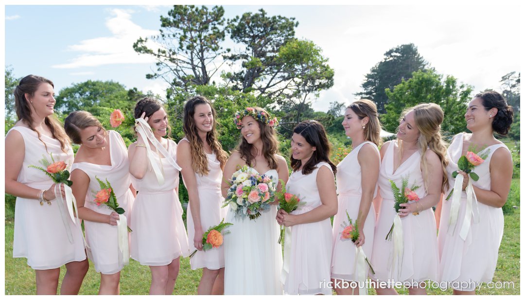 candid moment of bride and bridesmaids at New Hampshire Seacoast Science Center wedding
