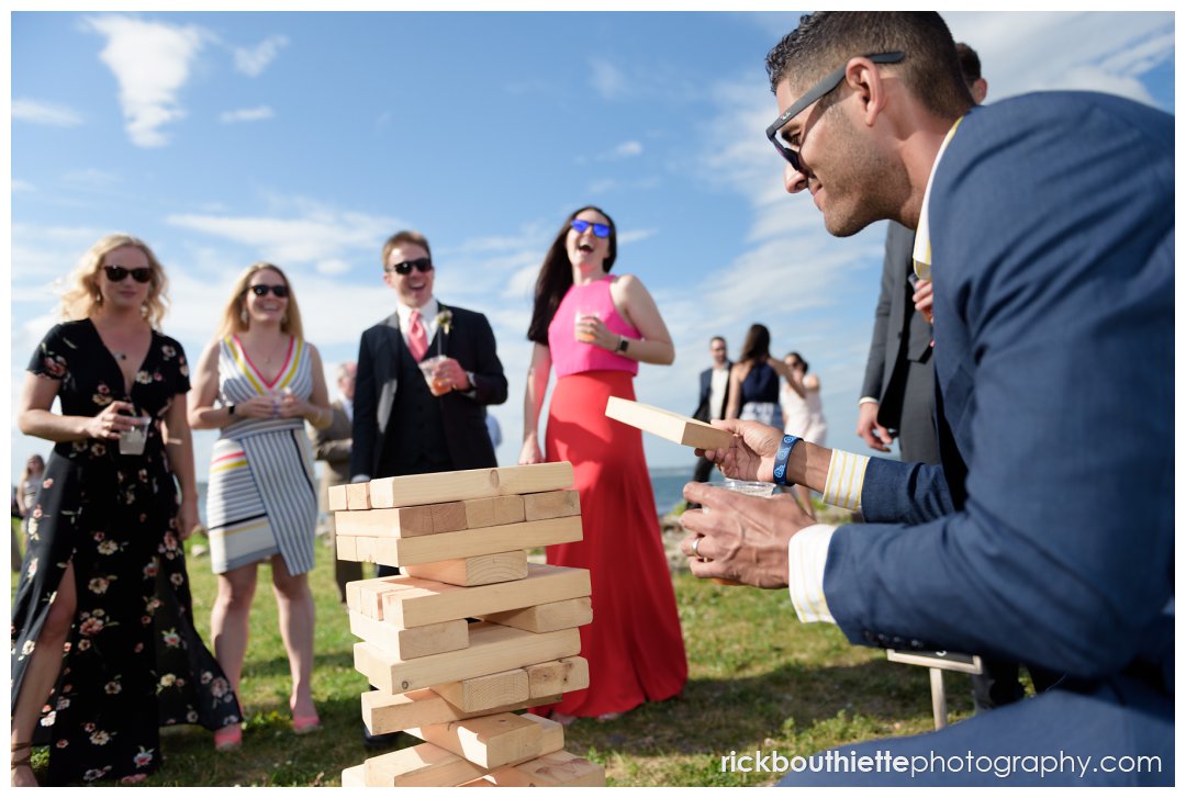 guests playing Jenga lawn game at New Hampshire Seacoast Science Center wedding