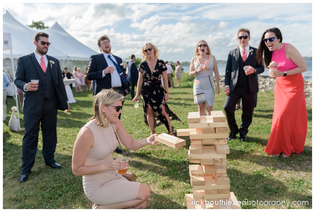 guests playing Jenga lawn game at New Hampshire Seacoast Science Center wedding
