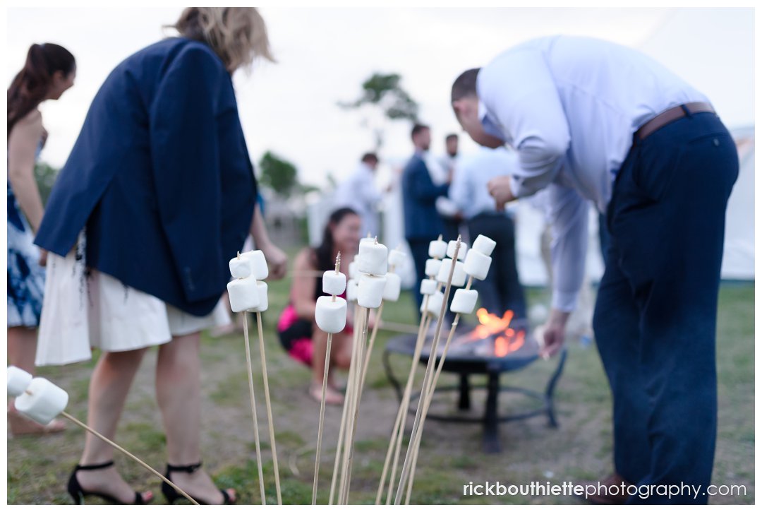 guests enjoying S'mores by the fire at New Hampshire Seacoast Science Center wedding reception