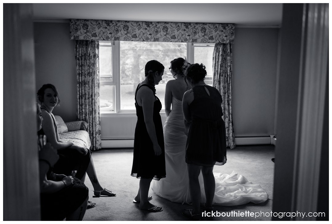 black & white silhouette of bride getting ready for her wedding