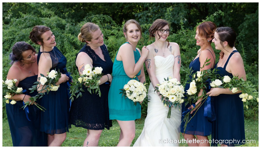 bride and her bridesmaids celebrating after wedding ceremony