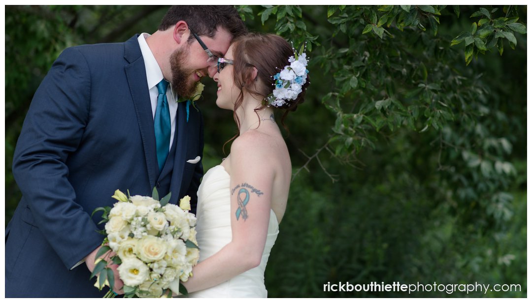 portrait of bride and groom after New Hampshire backyard summer wedding ceremony