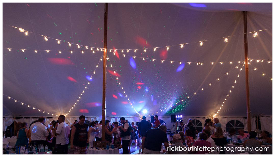 overall view of guest dancing at New Hampshire backyard summer wedding reception