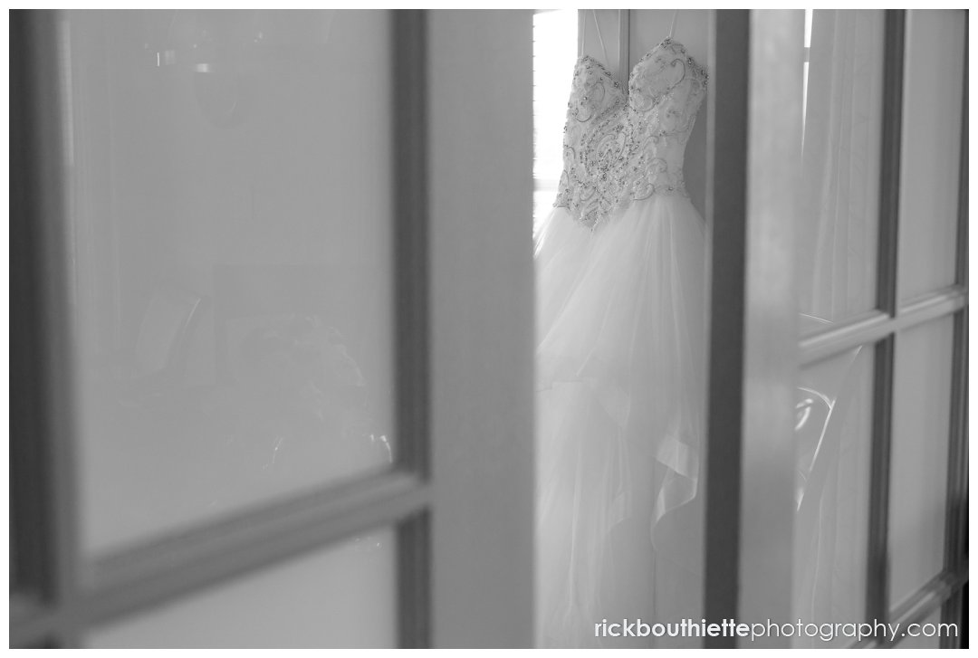 wedding dress through door opening at Mountain View Grand wedding