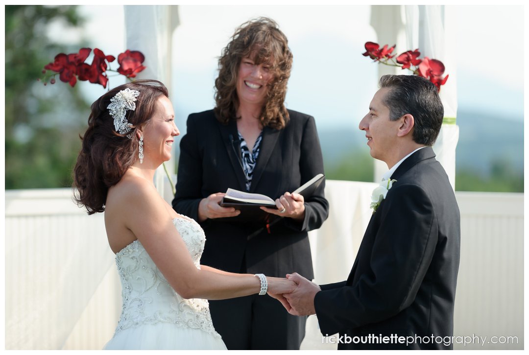 bride and groom exchange vows at Mountain view Grand wedding ceremony