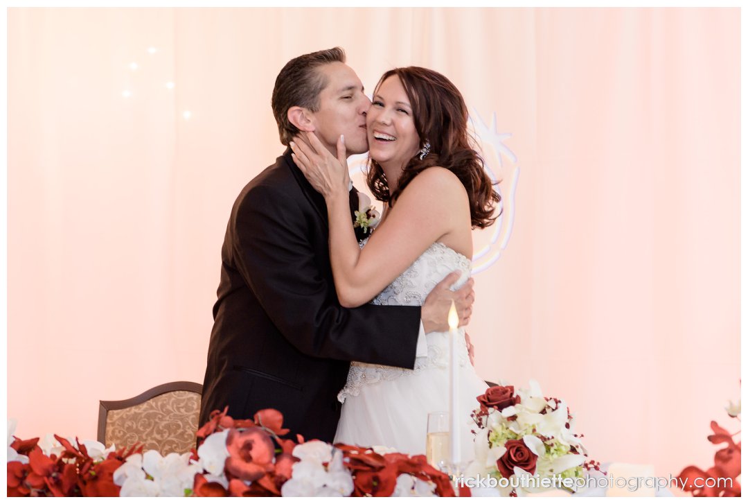 bride and groom kiss at wedding reception at Mountain View Grand Resort