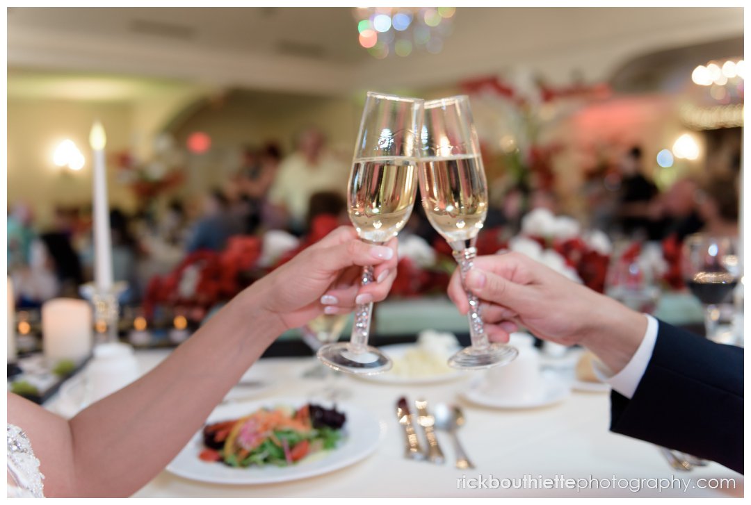 bride and groom holding champagne glasses at Mountain View Grand Resort wedding