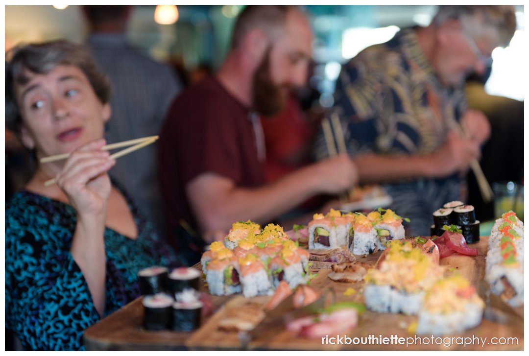 guest enjoy sushi at rehearsal dinner at the Surf Room in Portsmouth