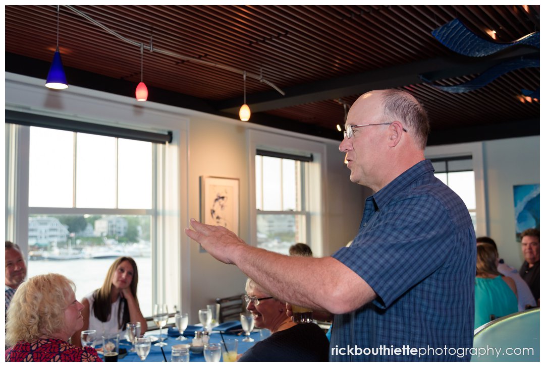 guests enjoy a toast to the couple at wedding rehearsal dinner at Surf Room